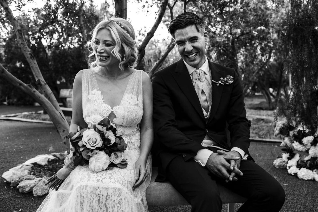 Black and white portrait of a laughing bride and groom at a wedding in Almería