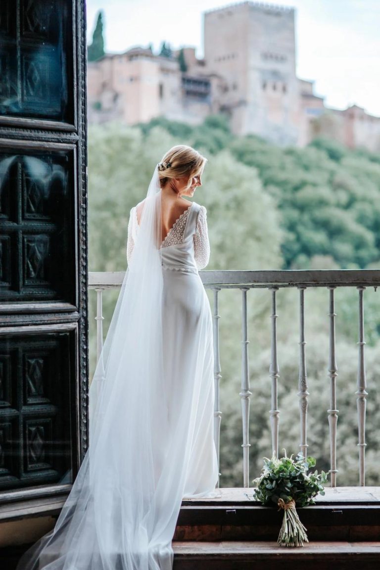 Bride on a balcony overlooking the Alhambra in Granada